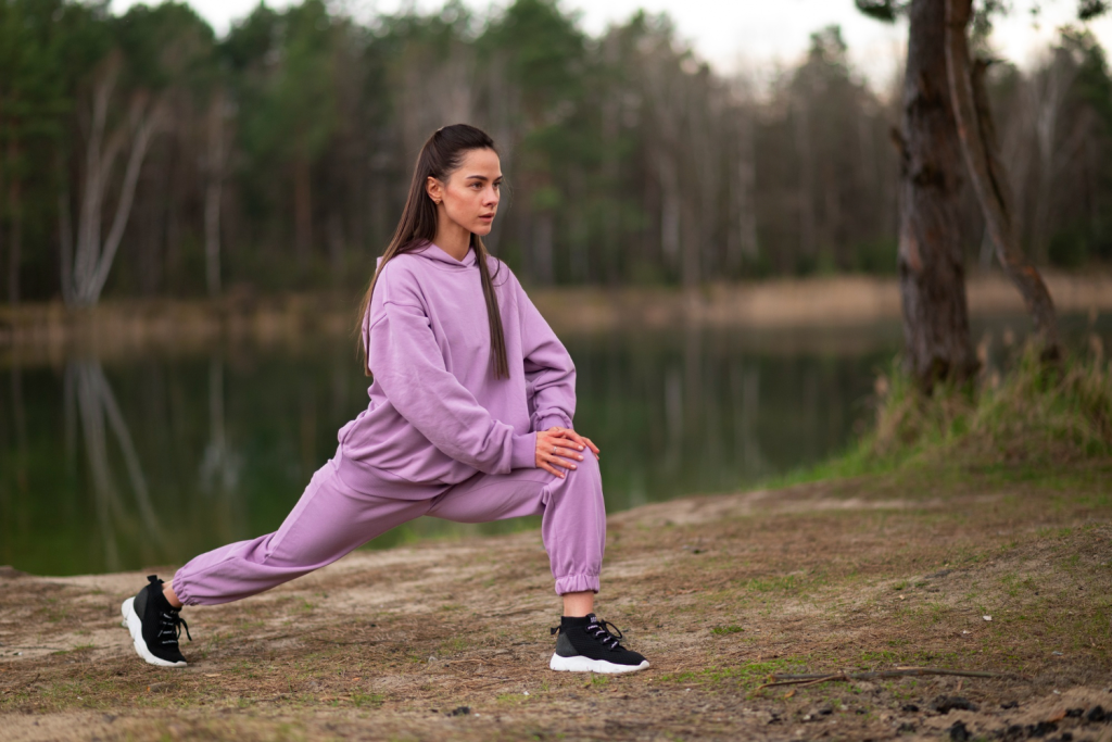 women doing cardio wearing a hoodie