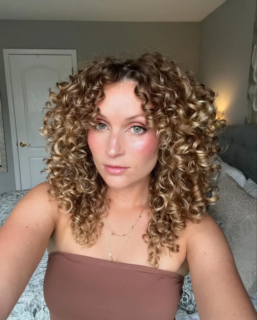 Blonde Ringlet Curls With Curtain Bangs